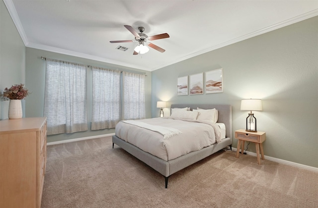 bedroom featuring ceiling fan, light colored carpet, and crown molding