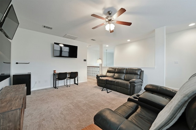 living room featuring ceiling fan and light colored carpet