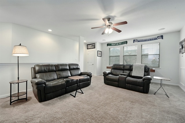 living room featuring light carpet and ceiling fan