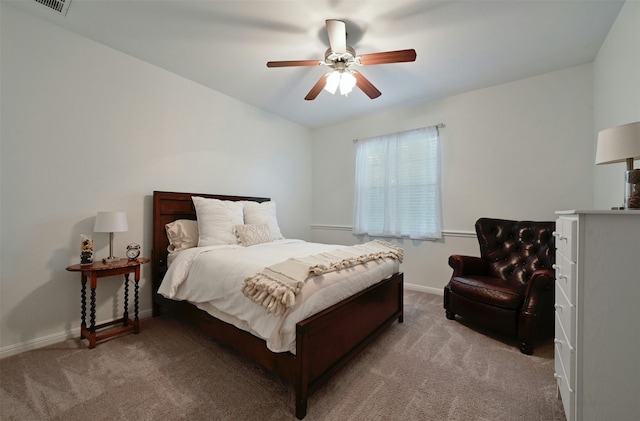 bedroom with ceiling fan and light colored carpet