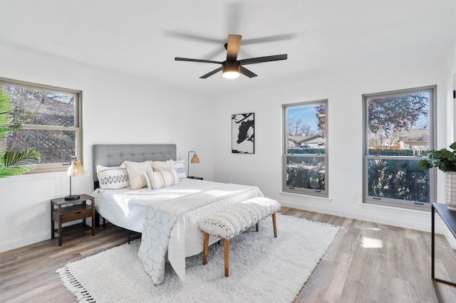 bedroom featuring ceiling fan and light hardwood / wood-style floors