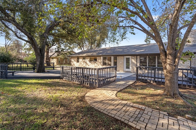 exterior space featuring a wooden deck