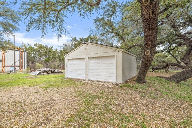 garage with a yard