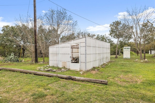 view of outdoor structure with a yard