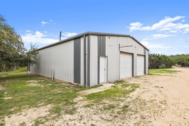 view of outbuilding with a garage