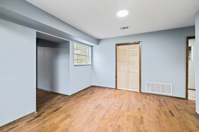 unfurnished bedroom featuring hardwood / wood-style flooring