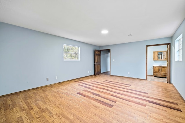 unfurnished bedroom featuring light wood-type flooring