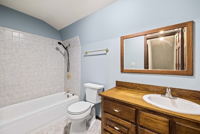 full bathroom with lofted ceiling, vanity, toilet, and tiled shower / bath combo