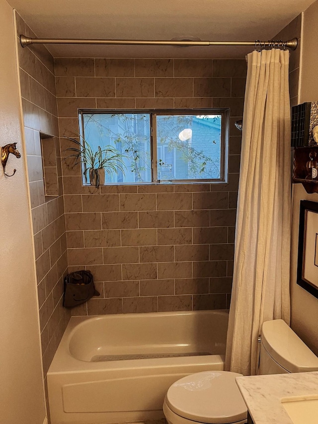 full bathroom with toilet, vanity, and shower / bath combo with shower curtain