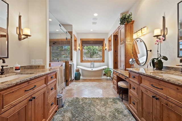 bathroom featuring a bathing tub and vanity