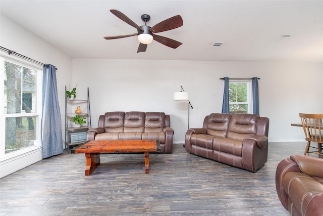 living room featuring ceiling fan, a healthy amount of sunlight, and hardwood / wood-style flooring