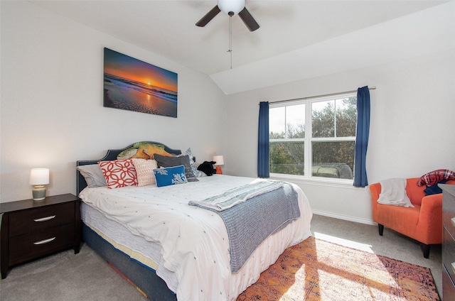 carpeted bedroom featuring lofted ceiling and ceiling fan