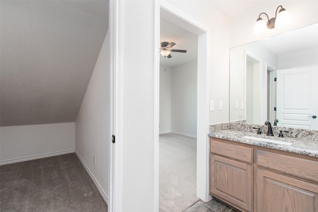 bathroom featuring ceiling fan and vanity