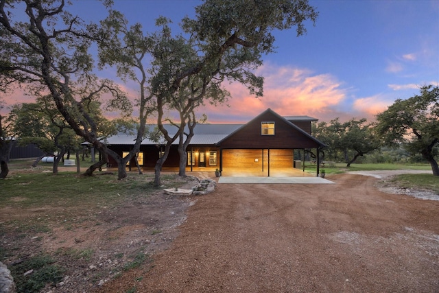 view of front facade with a carport