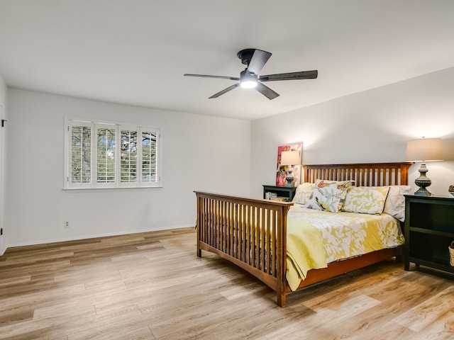 bedroom with ceiling fan and light hardwood / wood-style flooring