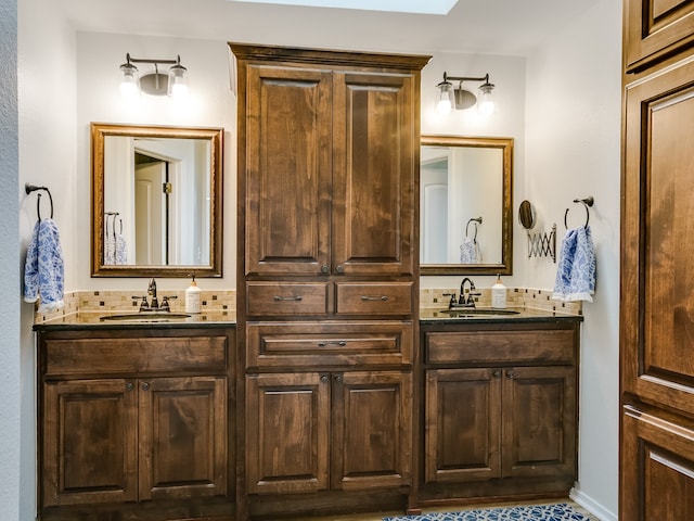 bathroom featuring vanity and a skylight