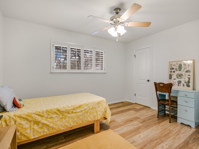 bedroom featuring ceiling fan and hardwood / wood-style flooring