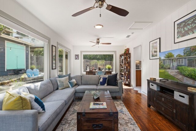 living room featuring dark hardwood / wood-style flooring and plenty of natural light