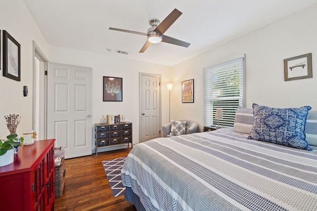 bedroom with ceiling fan and dark hardwood / wood-style floors