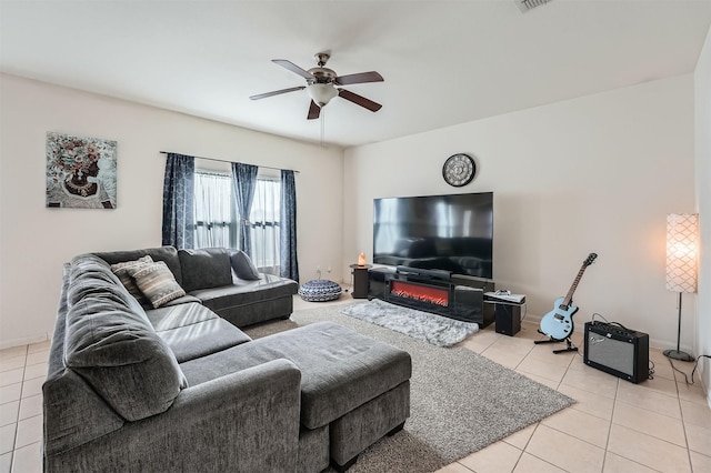 living room with ceiling fan and light tile patterned floors