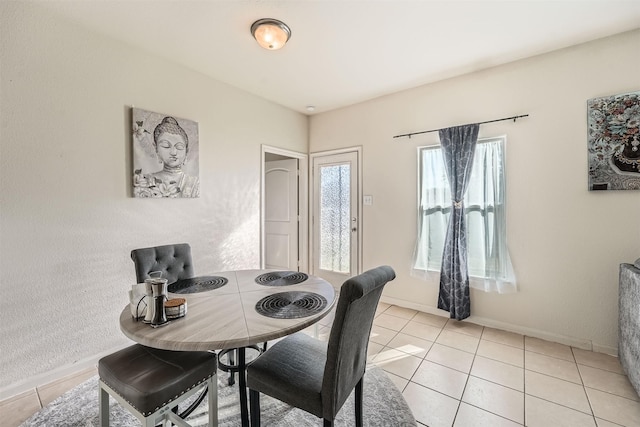 view of tiled dining space