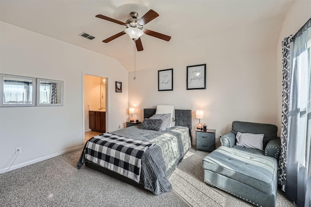 carpeted bedroom with connected bathroom, ceiling fan, and vaulted ceiling