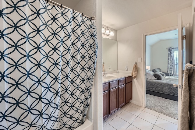 bathroom featuring a shower with shower curtain, tile patterned floors, a chandelier, and vanity