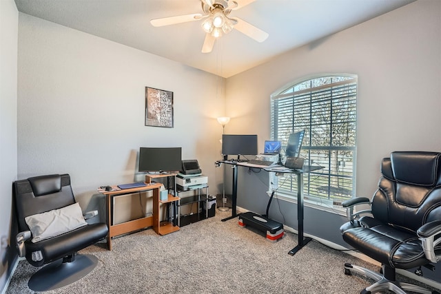 office area with ceiling fan and carpet