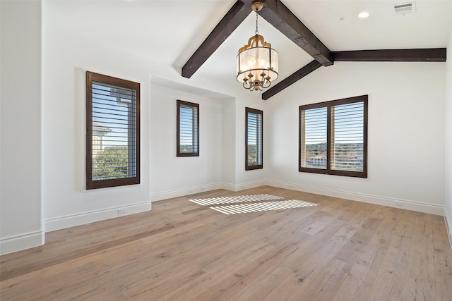 empty room with light hardwood / wood-style floors, vaulted ceiling with beams, and a chandelier