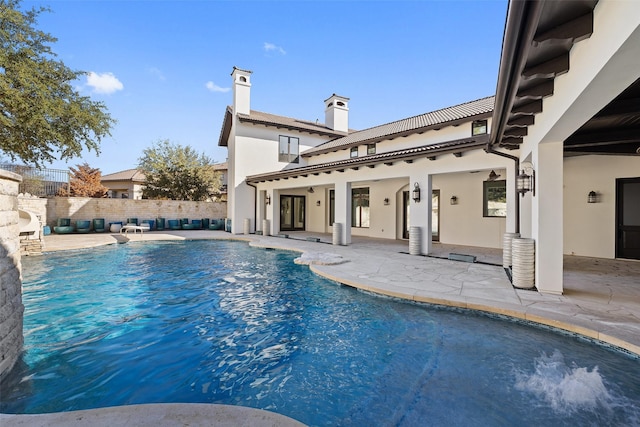 view of swimming pool with a patio