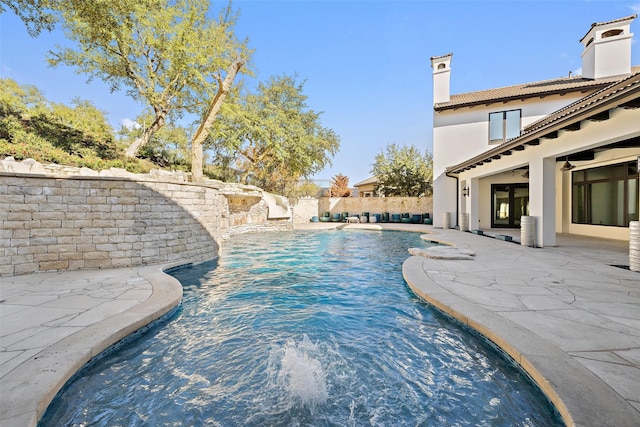 view of swimming pool featuring a patio