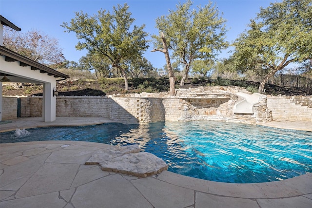 view of swimming pool featuring a patio and pool water feature