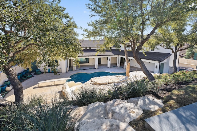 back of house with a patio area