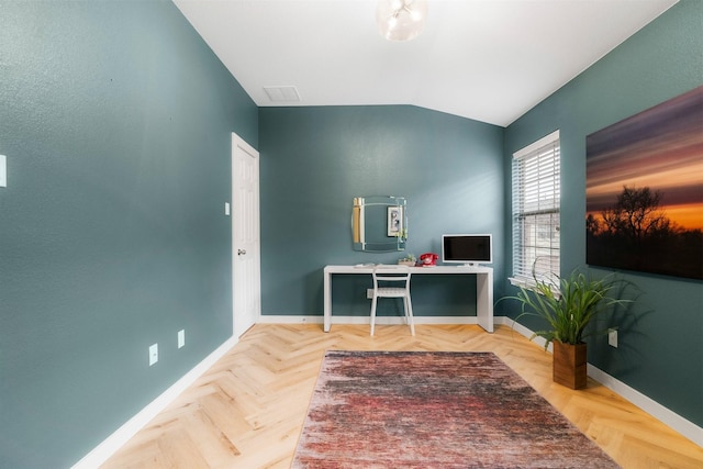 office space featuring lofted ceiling and parquet floors