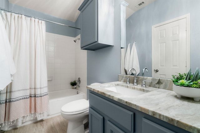 full bathroom featuring toilet, vanity, and shower / bath combination with curtain