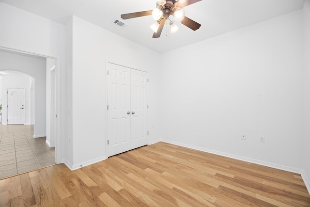 spare room with ceiling fan and light hardwood / wood-style flooring