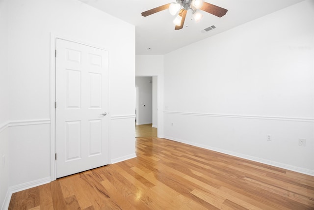 unfurnished bedroom featuring ceiling fan and light wood-type flooring