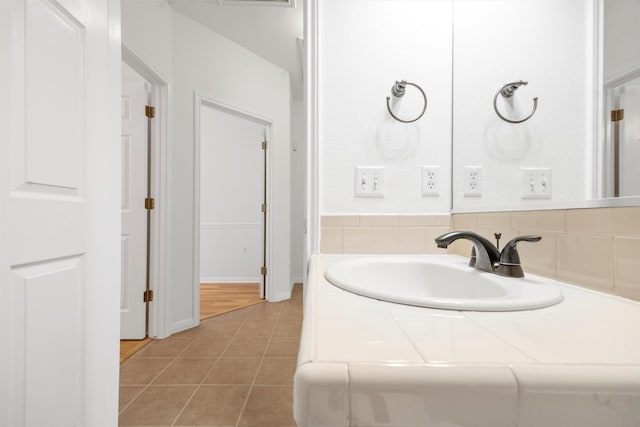 bathroom with tile patterned flooring and vanity