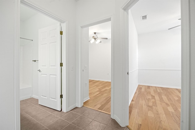 corridor featuring tile patterned floors