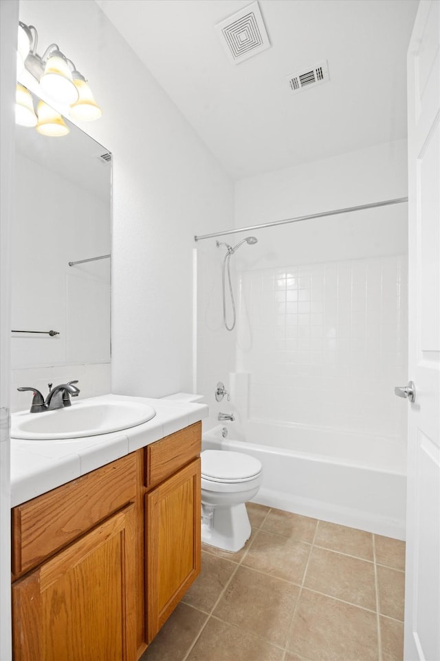 full bathroom featuring tile patterned flooring, bathtub / shower combination, vanity, and toilet