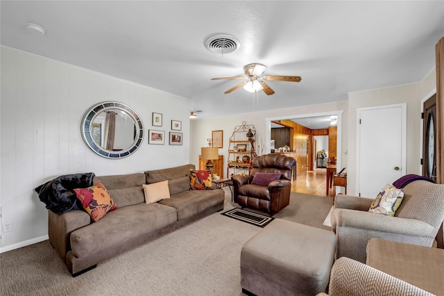 living room with ceiling fan and carpet flooring