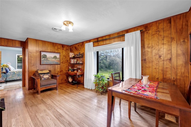 dining space featuring light wood-type flooring