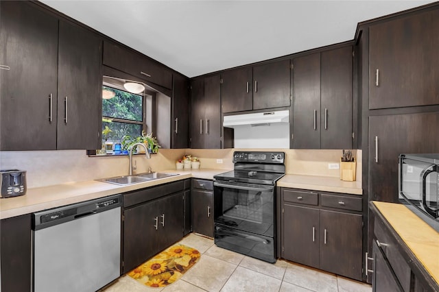 kitchen featuring dark brown cabinetry, light tile patterned flooring, black appliances, and sink