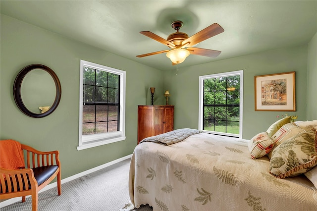 bedroom featuring ceiling fan and carpet