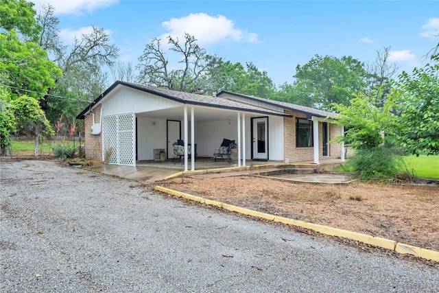 single story home with a carport