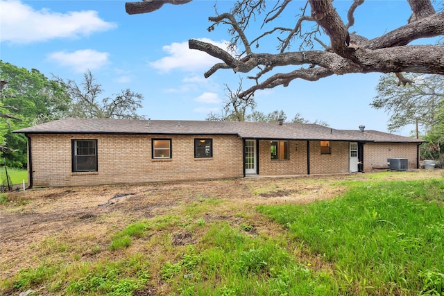 rear view of property with cooling unit