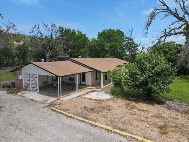 view of front of home with a carport