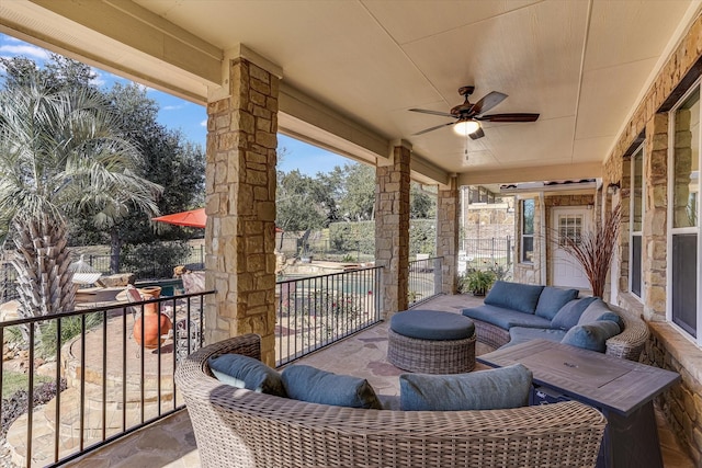 view of patio / terrace with an outdoor living space and ceiling fan