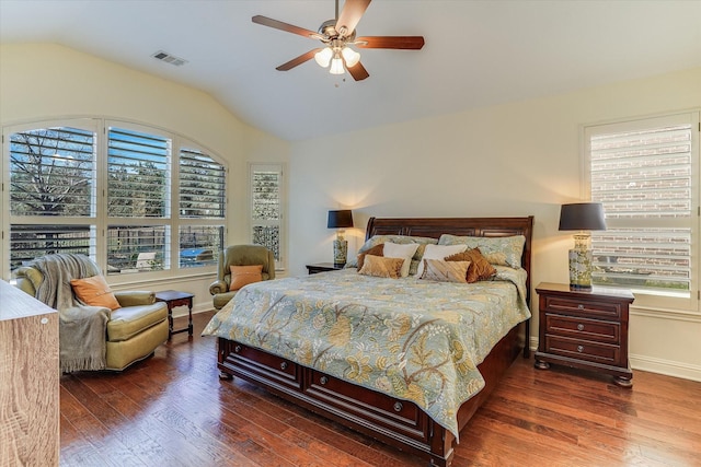 bedroom with lofted ceiling, dark wood-type flooring, multiple windows, and ceiling fan