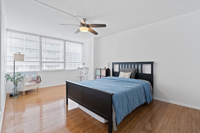 bedroom featuring hardwood / wood-style flooring and ceiling fan